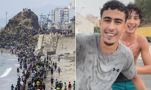 Migrants film themselves cheering in the streets of Ceuta after 'thousands of youths lured by social media posts'