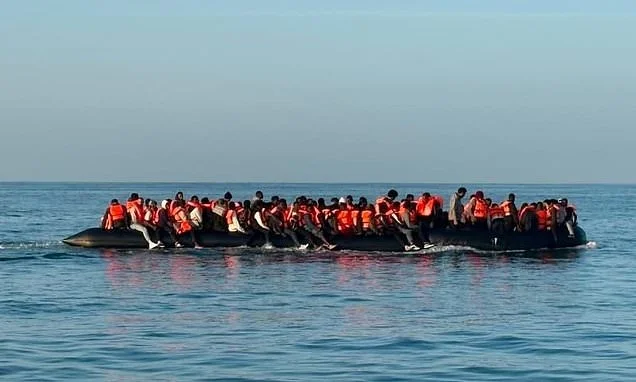 Mega-dinghy 'carrying 150 migrants' catches fire in the Channel as British and French coastguard launch rescue operation