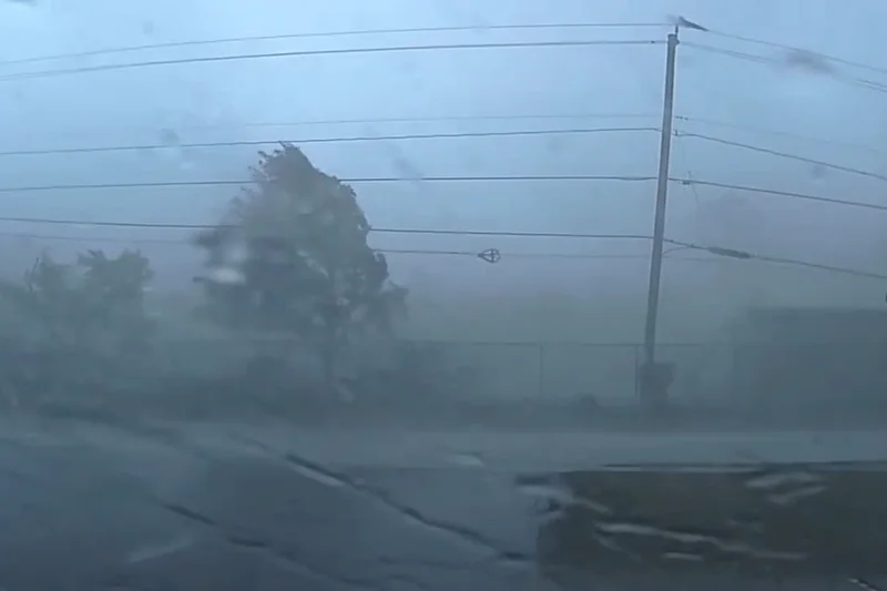 Police officer trapped in the middle of tornado caught on terrifying dashcam