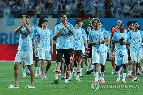 Record-breaking heat, absence of stars lead to small crowd in Man City match in Seoul