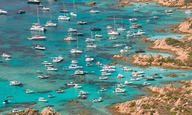 Sardinian coastal beauty spots are overrun by 'locust swarm' of tourist party boats sparking fury among conservationists