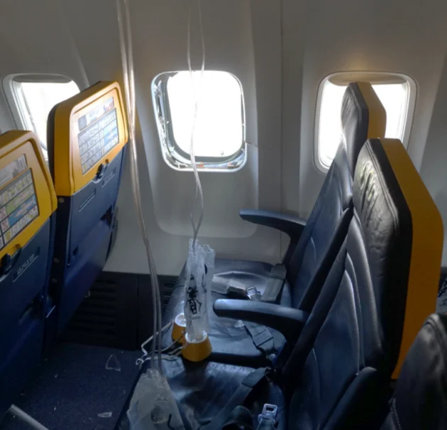 Broken engine part shattered Ryanair plane window that saw man nearly sucked out, probe finds