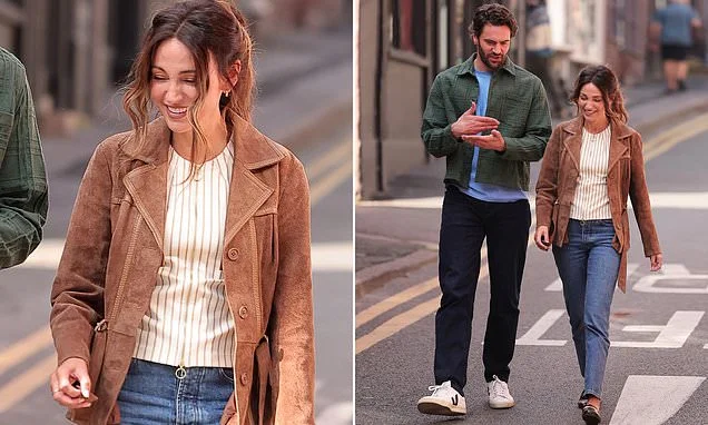 Michelle Keegan shares a joke with her hunky co-star Tom Bateman as they take a break from filming new Harlan Coben drama The Woods
