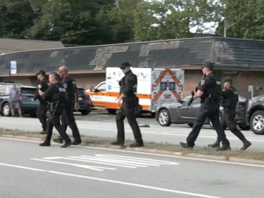 Possibly armed woman wanted in connection with off-duty officer death