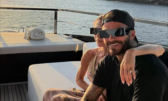 David and Victoria Beckham wear solar glasses as they 'manifest and make wishes' while watching once-in-a-generation eclipse from $16million luxury yacht in Portofino