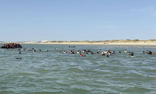 Record breaking mega dinghy which reached Britain with 230 migrants was carrying more than 260 including children...as French authorities warn there is 'no limit' to how big Channel boats will get