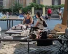Scramble to house hundreds camping in Rome heatwave after squat eviction