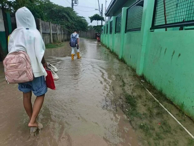 Flooded pathway disrupts students’ access to Dumlog school