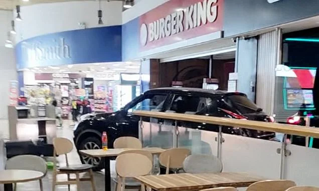 Moment audacious ram raid gang reverse car through service station and steal ATM and slot machines