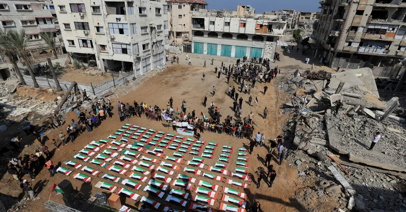 Gazans bury nearly a whole clan found in rubble in mass funeral for 112