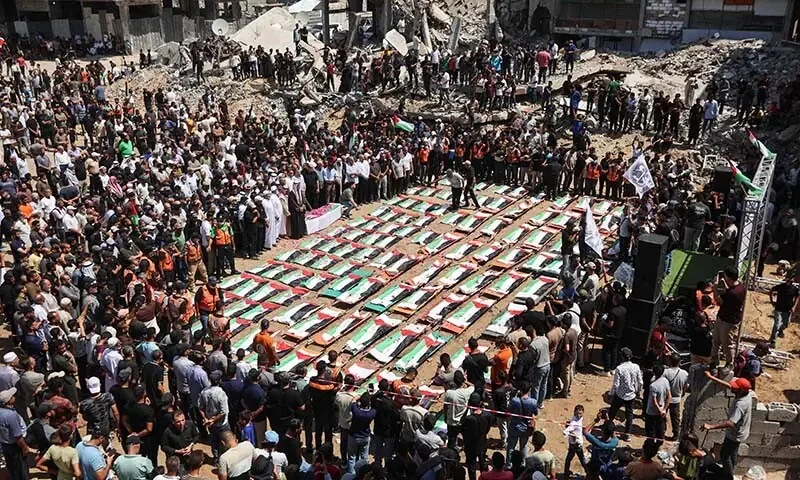 Palestinians mourn 112 people retrieved from rubble in Gaza