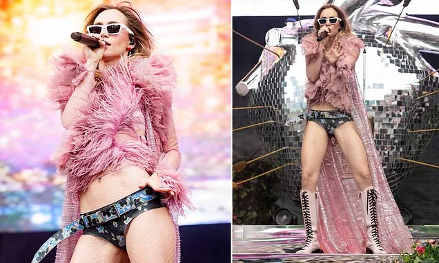 Suki Waterhouse rocks tiny pants and feathers on stage as she reveals she has never seen partner Robert Pattinson's Twilight films