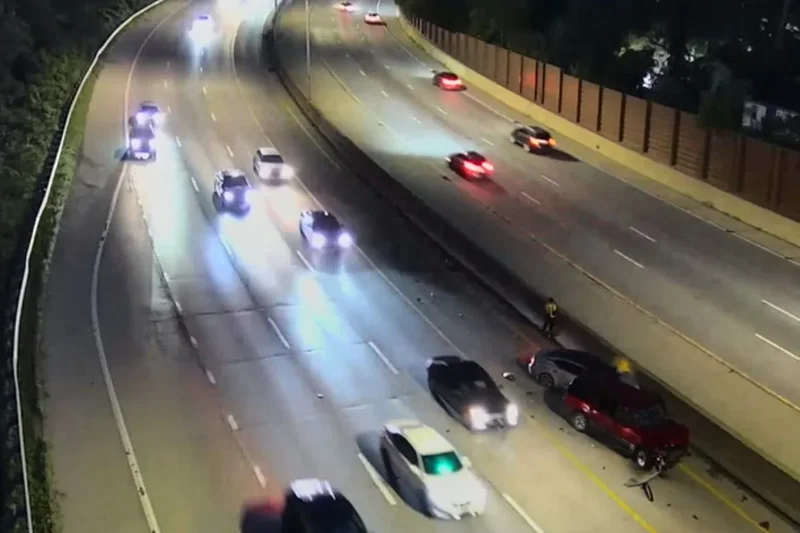 Stranded driver leaps out of way as car smashes into his disabled vehicle on highway