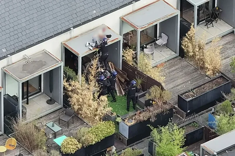 Police end two-day stand-off after suspect found asleep on roof