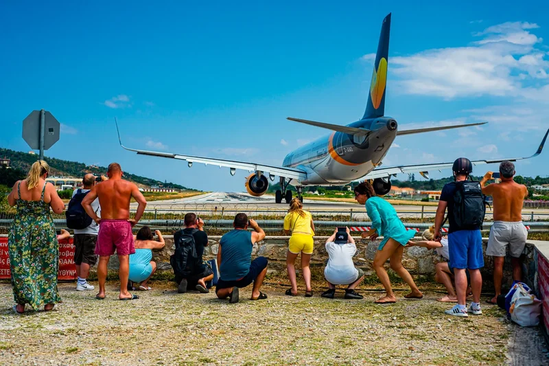 Horror at plane-spotting beach as tourist suffers serious head injury after being blasted by flight