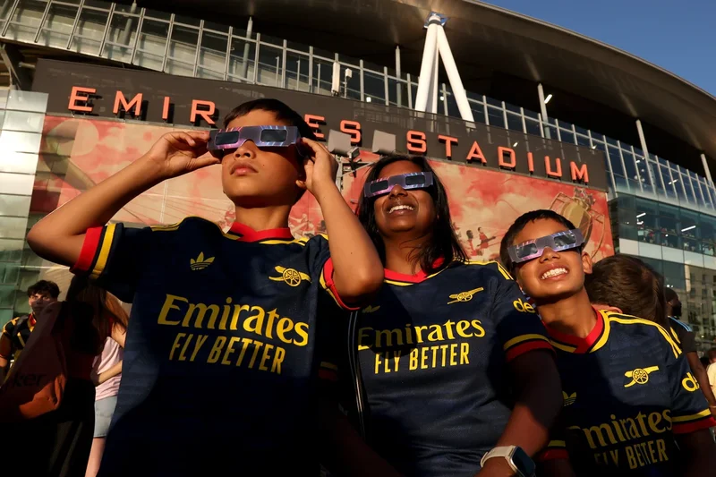 Best solar eclipse photos as sports fans enjoy historic event at stadiums across Europe