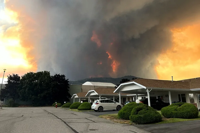 Tens of thousands flee British Columbia wildfire as state of emergency declared