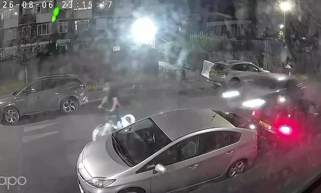 Shocking moment car ploughs into cyclist in his 50s as man, 33, is charged with attempted murder