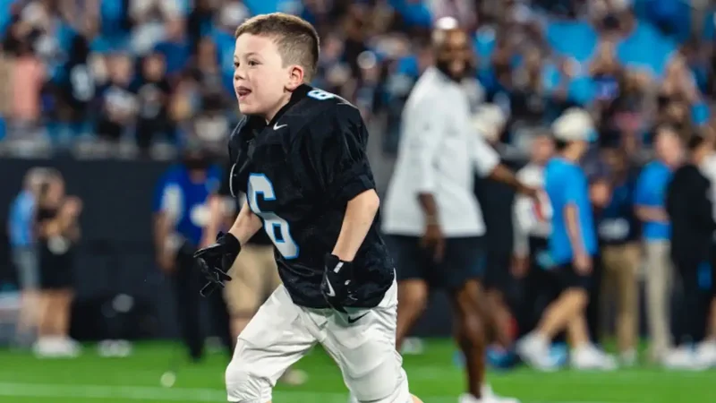 Boy with heart condition signs with Panthers and scores NFL touchdown