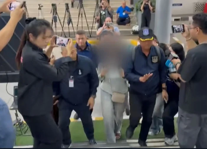 Woman courier cleared of drug smuggling in Japan returns home