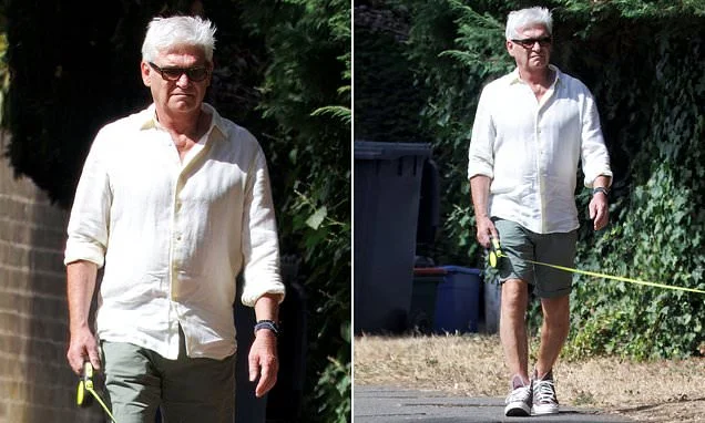 Phillip Schofield walks his beloved cockapoo Alfie as he's seen for the first time since former This Morning co-star Holly Willoughby launched her new YouTube show to mixed reviews