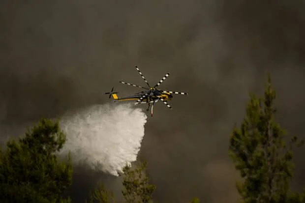 Water-bombing planes take to skies as Greece battles wildfires