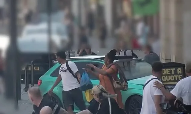 Moment teen driver narrowly misses pedestrians as he crashes car into chicken shop after high-speed police chase